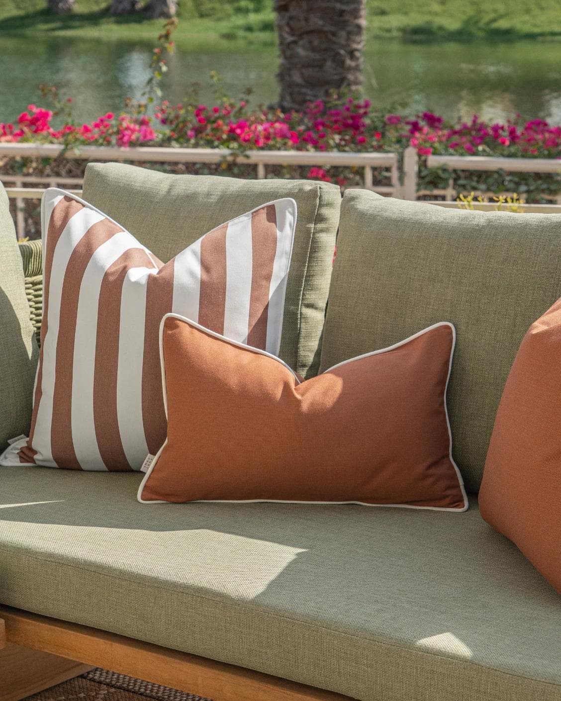 Pranvi Bundle cushion in rust and brown, shown in a lifestyle right view as image 8