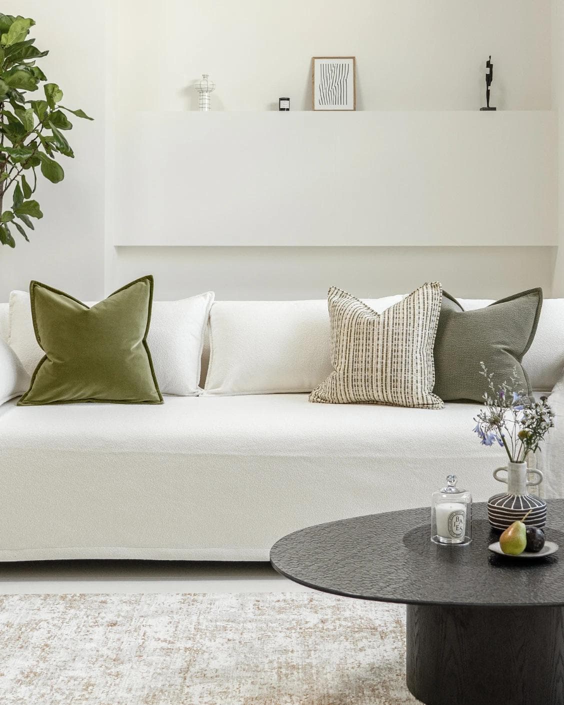 Praveen Bundle cushion in green and cream, shown in a lifestyle front view as image 4