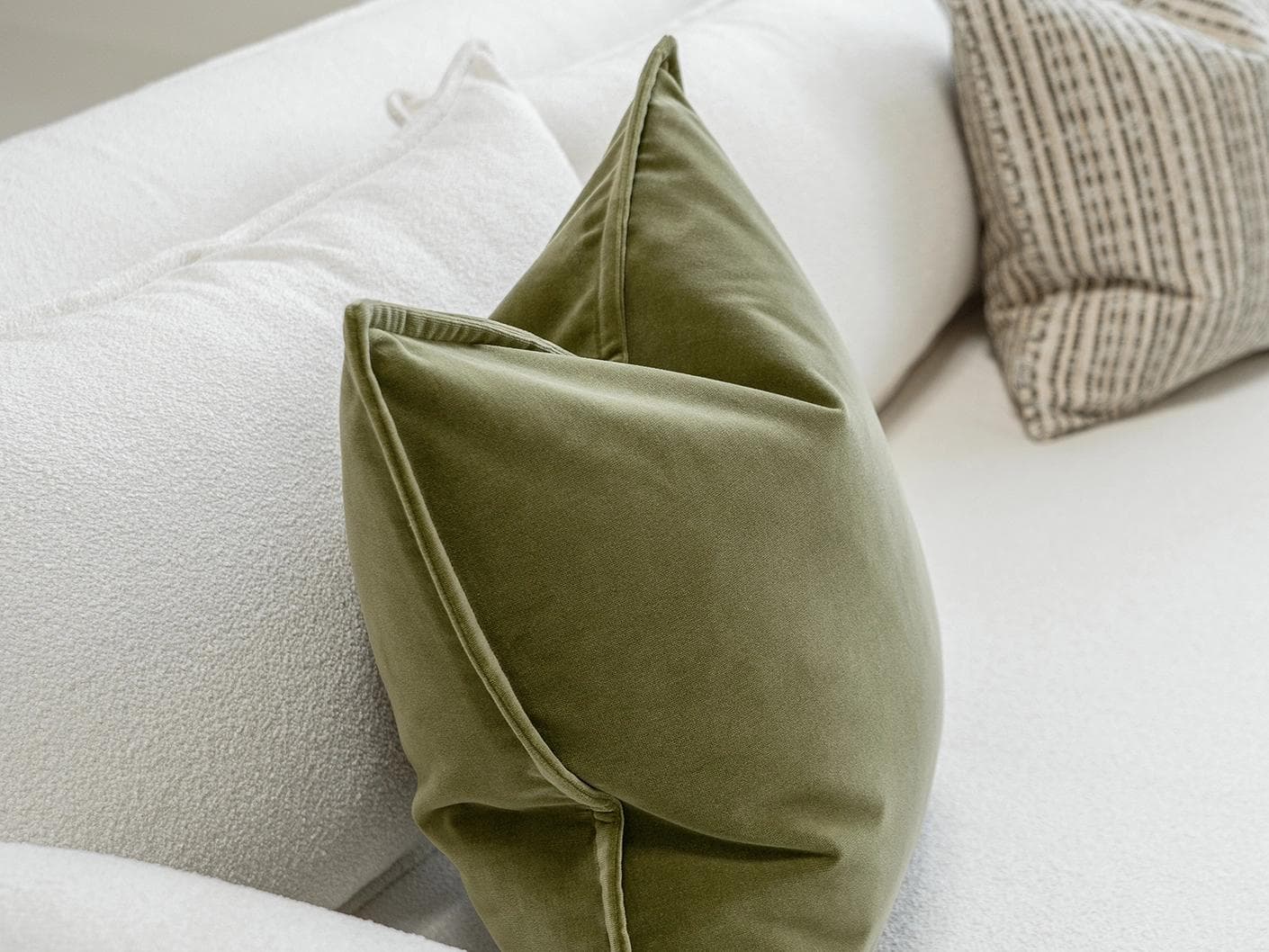 Praveen Bundle cushion in green and cream, shown in a product left view as image 5