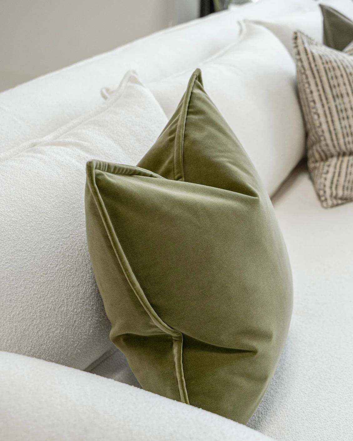 Praveen Bundle cushion in green and cream, shown in a product left view as image 5