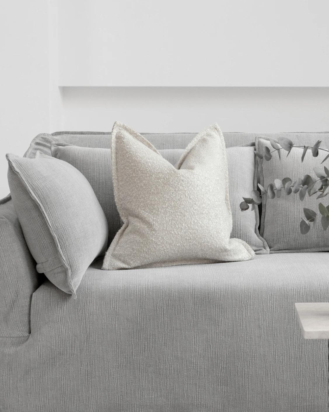Quinn Shale cushion in cream and beige, shown in a lifestyle front view as image 4
