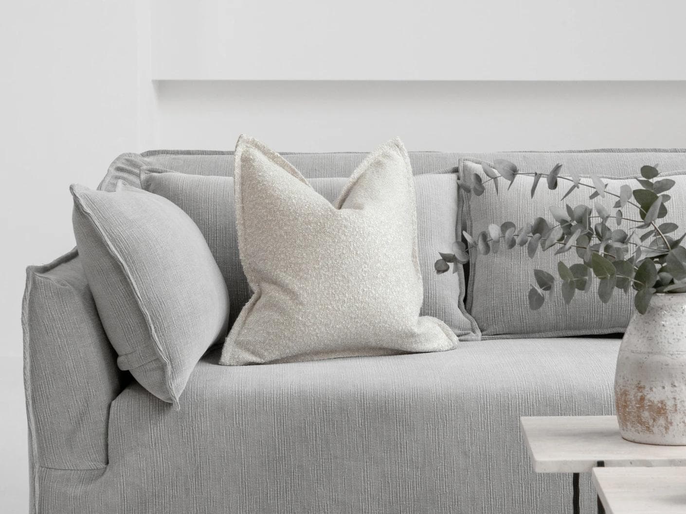 Quinn Shale cushion in cream and beige, shown in a lifestyle front view as image 4