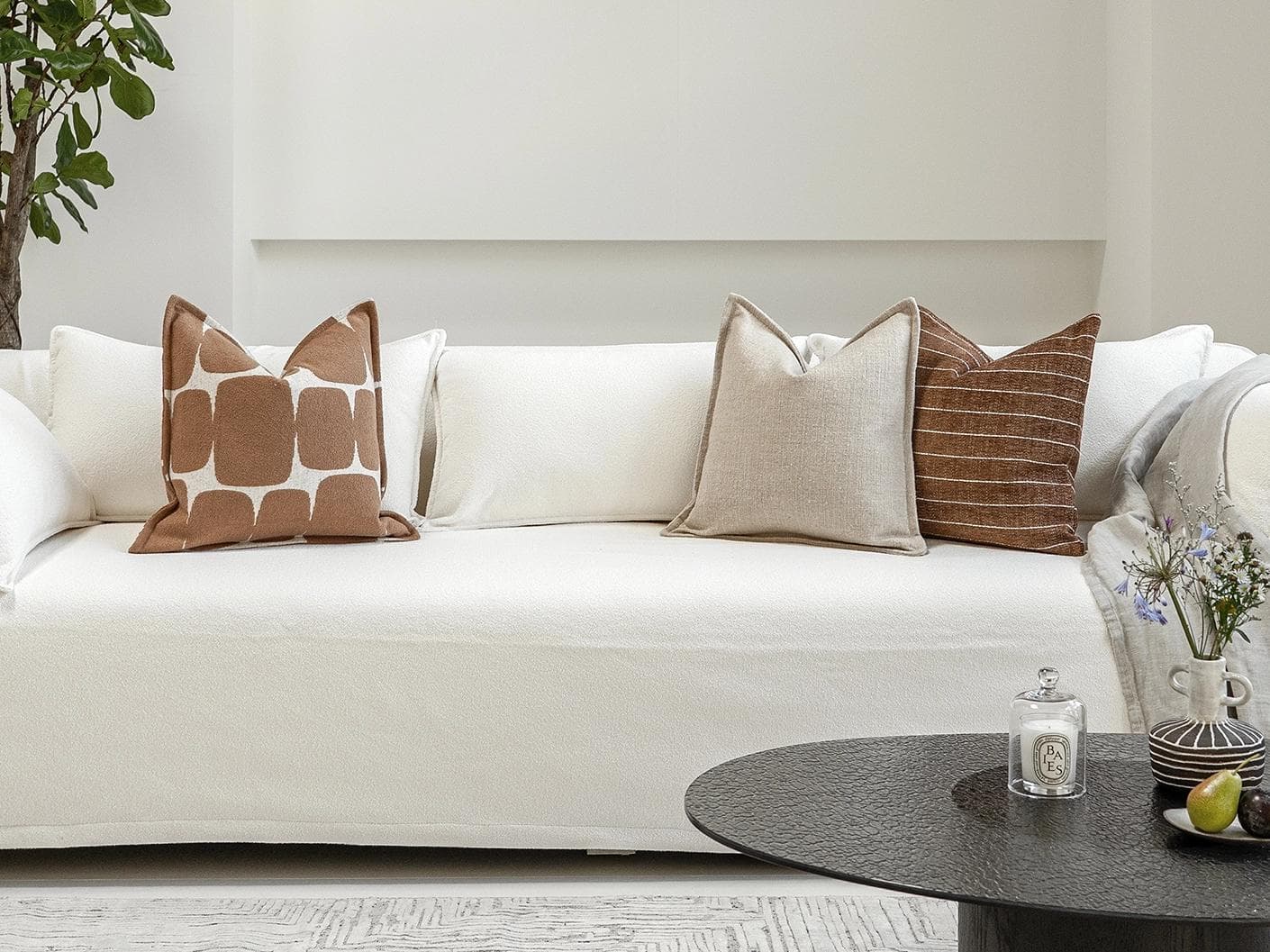 Ranjith Bundle cushion in beige and brown, shown in a lifestyle front view as image 4