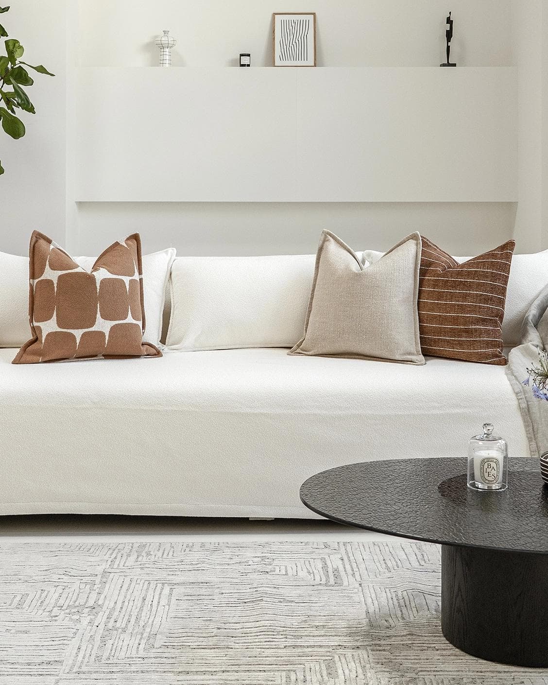 Ranjith Bundle cushion in beige and brown, shown in a lifestyle front view as image 4