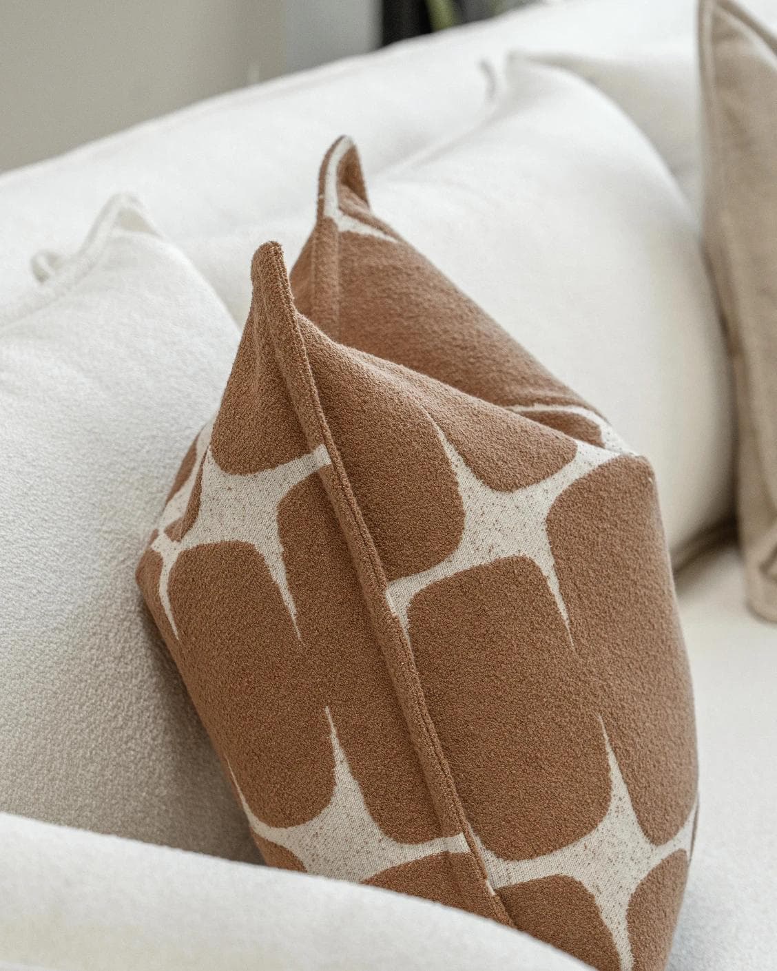 Ranjith Bundle cushion in beige and brown, shown in a product left view as image 6
