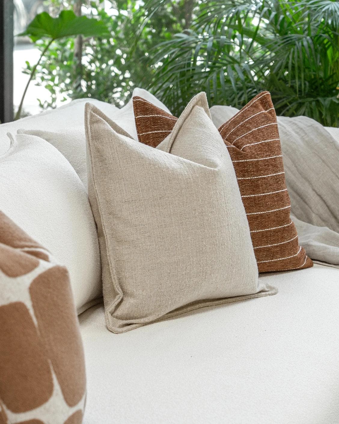 Ranjith Bundle cushion in beige and brown, shown in a product left view as image 7