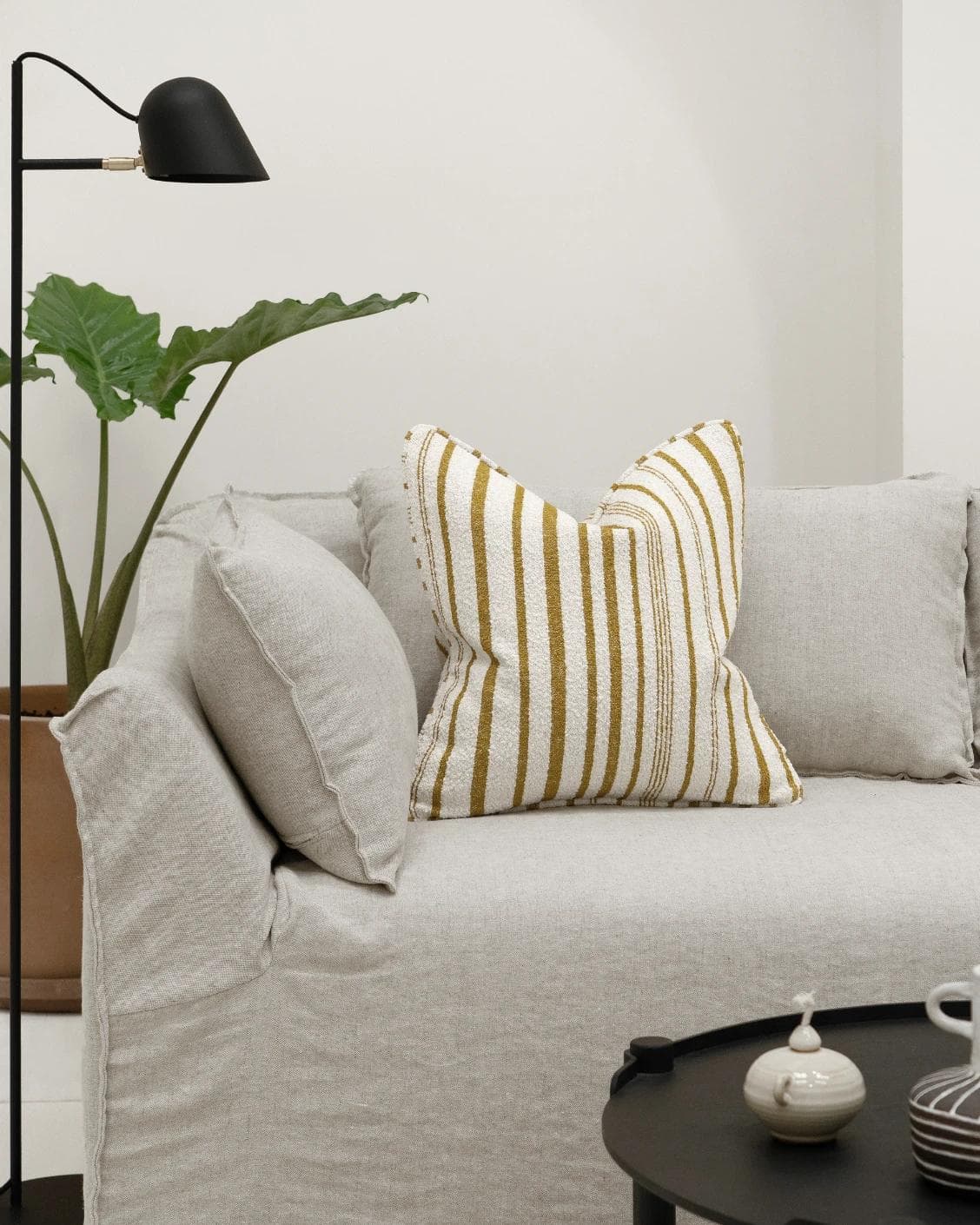 Raya Klimt cushion in ivory, shown in a lifestyle front view as image 4