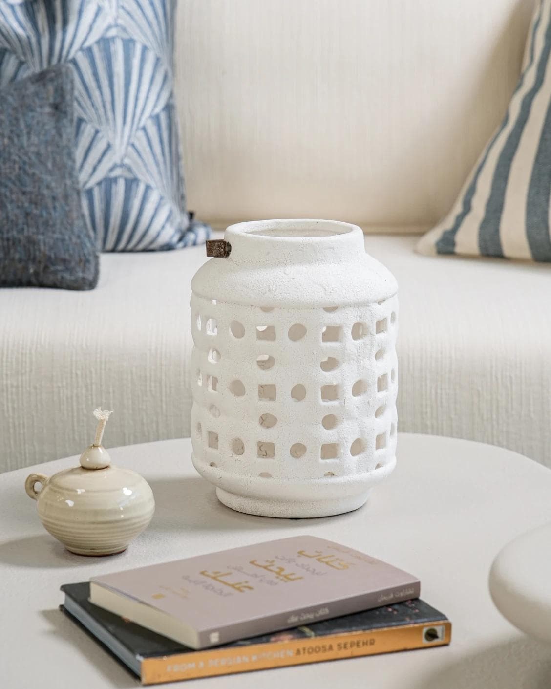Reba Terra candle holders in soft ivory and ivory, shown in a lifestyle front view as image 4