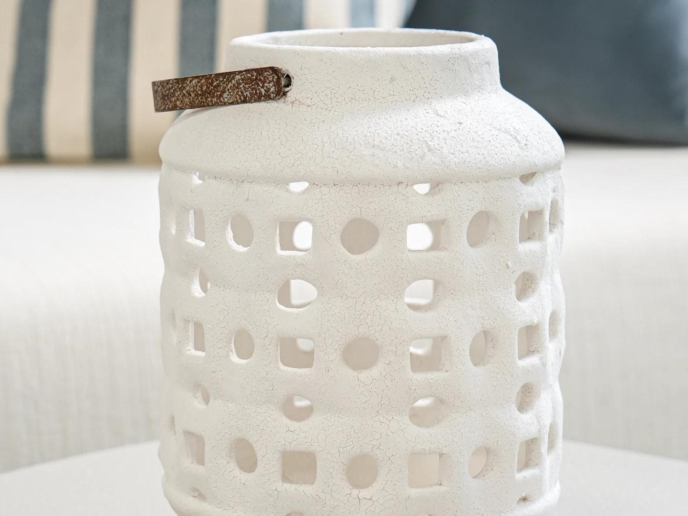 Reba Terra candle holders in soft ivory and ivory, shown in a lifestyle front view as image 2