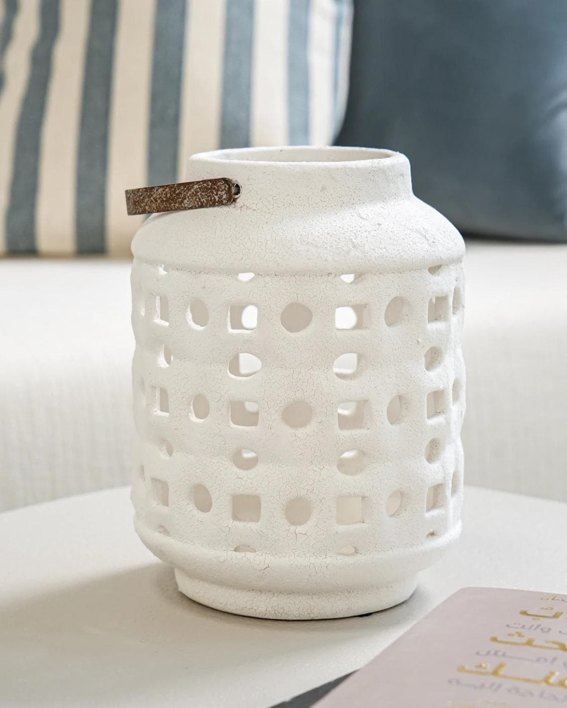 Reba Terra candle holders in soft ivory and ivory, shown in a lifestyle front view as image 2