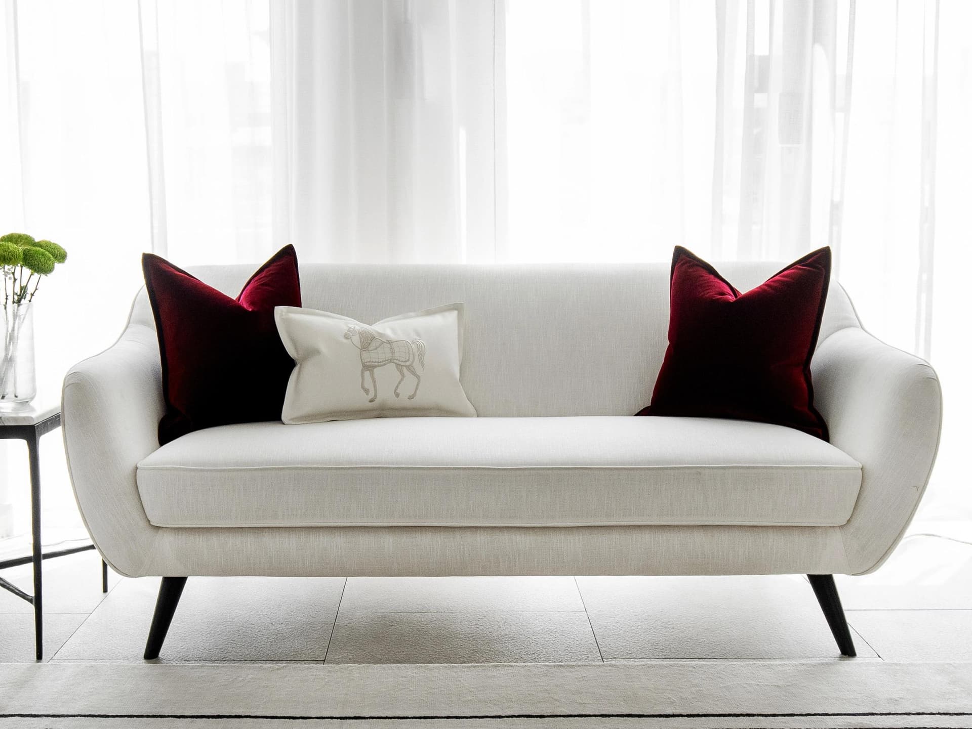 Garnet Bundle cushion in red, shown in a lifestyle front view as image 5