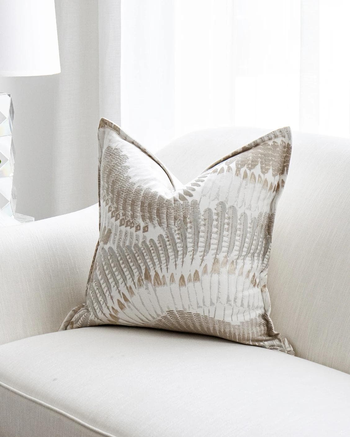 Reesha Bianca cushion in brown and grey, shown in a lifestyle front view as image 2