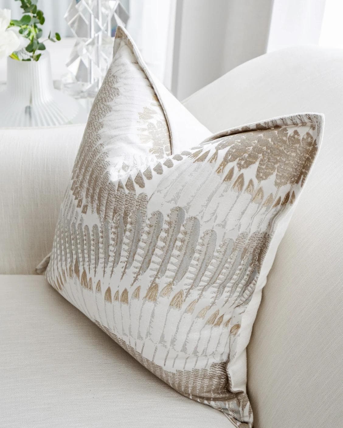 Reesha Bianca cushion in brown and grey, shown in a lifestyle top view as image 5