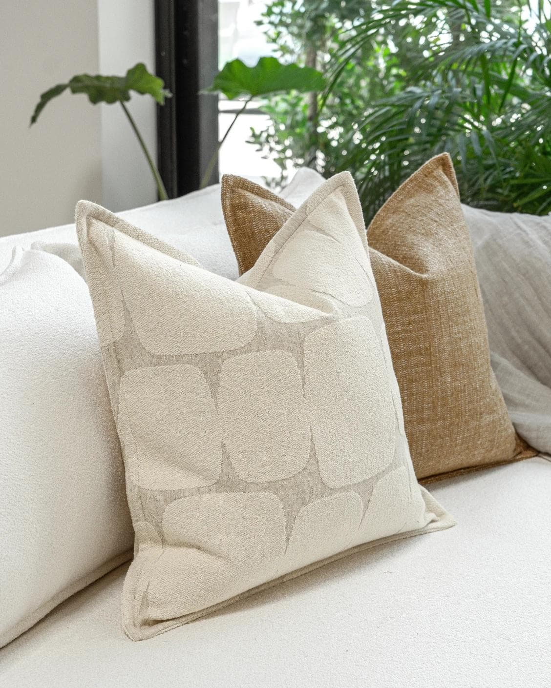 Rennie Bundle cushion in brown and white, shown in a product left view as image 5