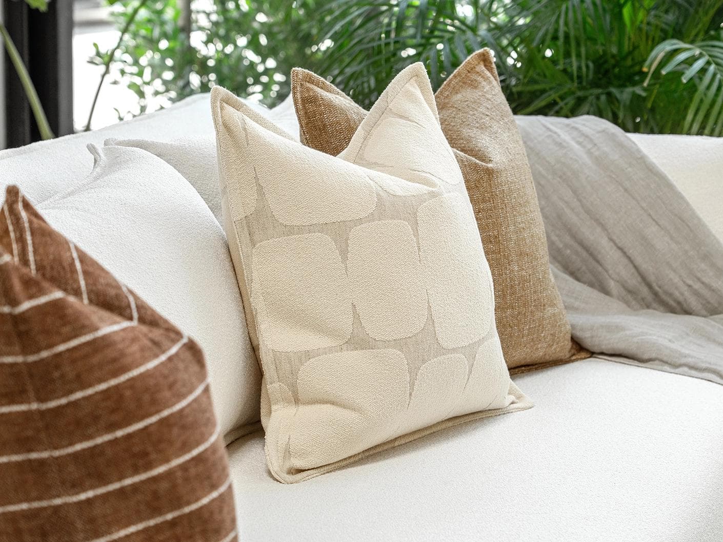 Rennie Bundle cushion in brown and white, shown in a product left view as image 7
