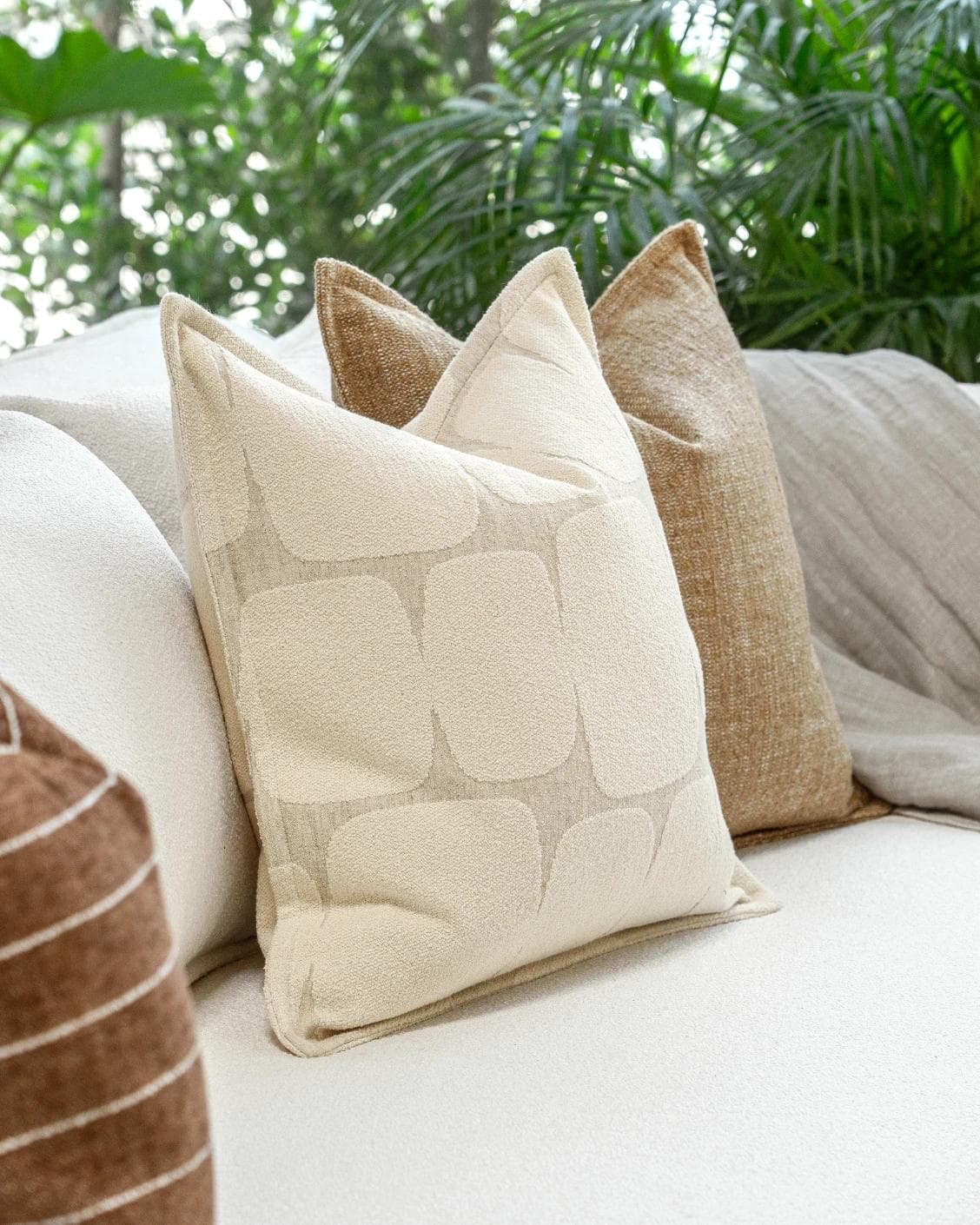 Rennie Bundle cushion in brown and white, shown in a product left view as image 7