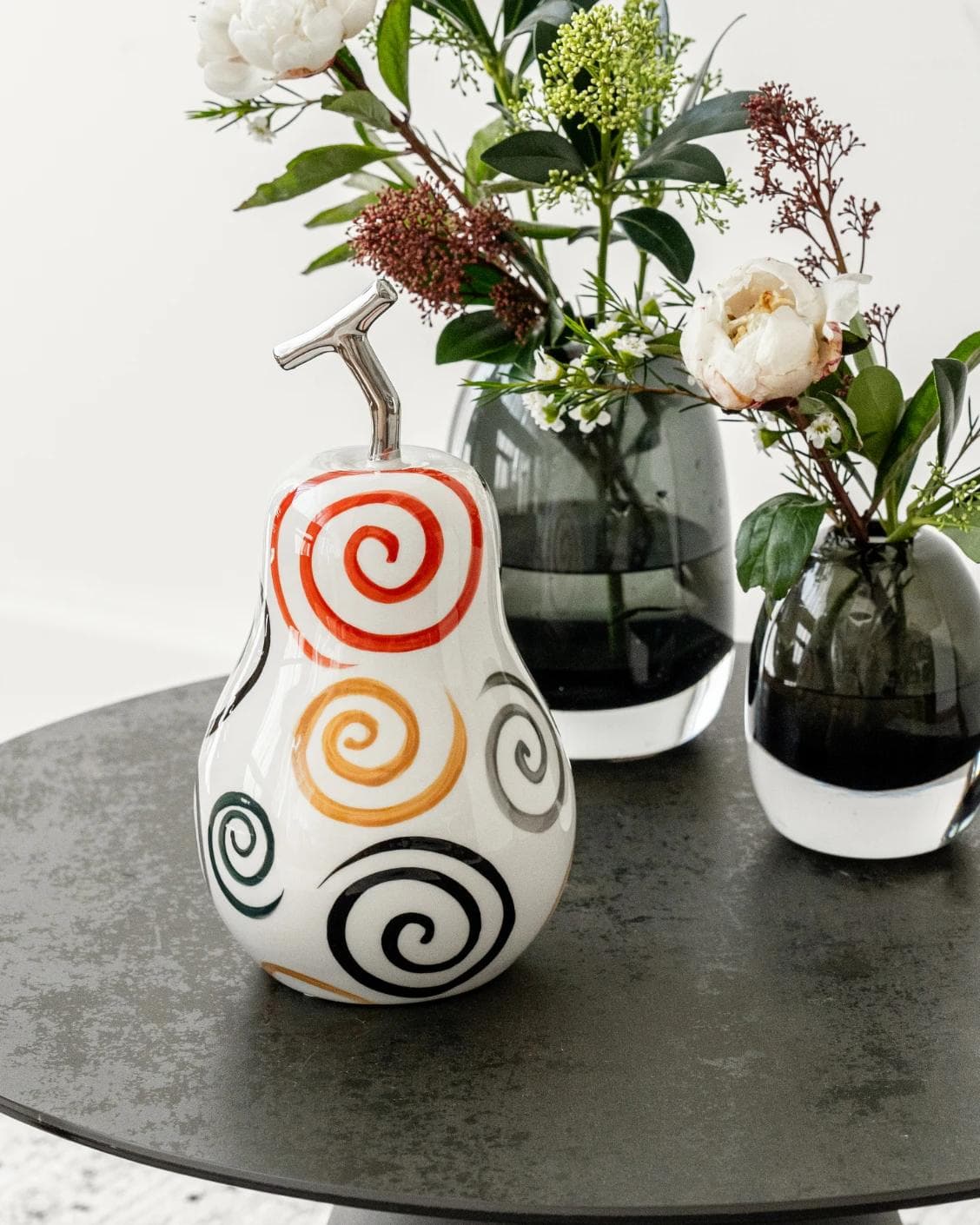 Rhea Arneson statues and sculptures in white, black and red, shown in a lifestyle front view as image 4