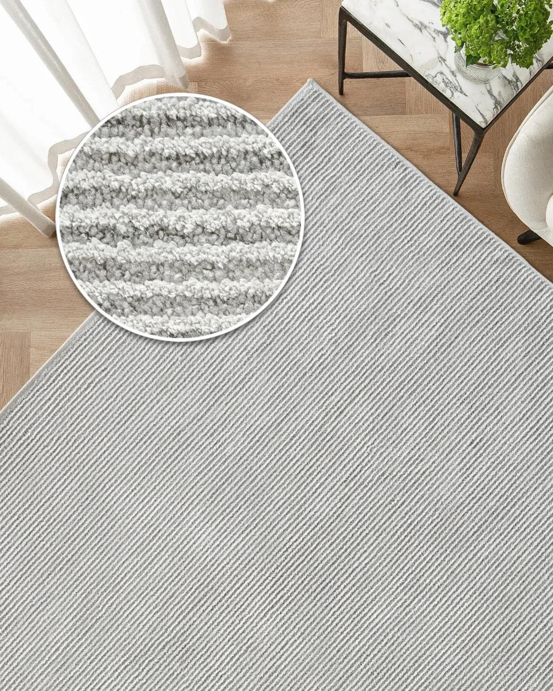 Rik Dune carpet in grey, shown in a lifestyle top view as image 2