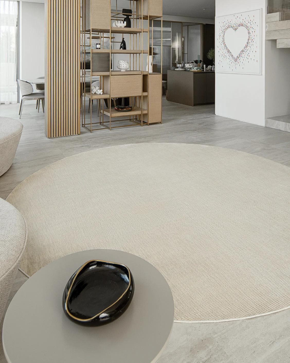 Rik Sandy Round carpet in beige, shown in a lifestyle left view as image 4
