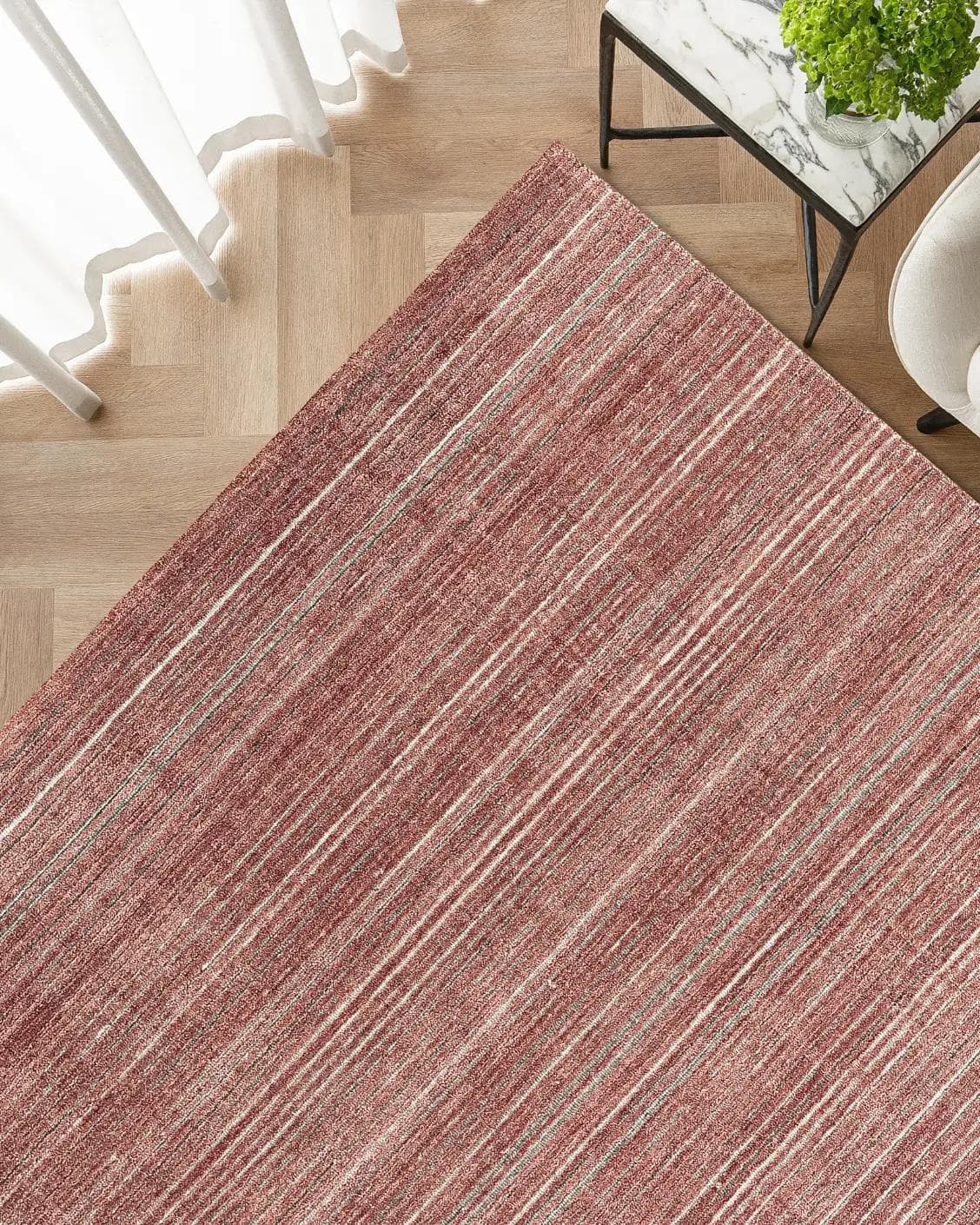 Rita Rosso II carpet in red, shown in a lifestyle top view as image 2
