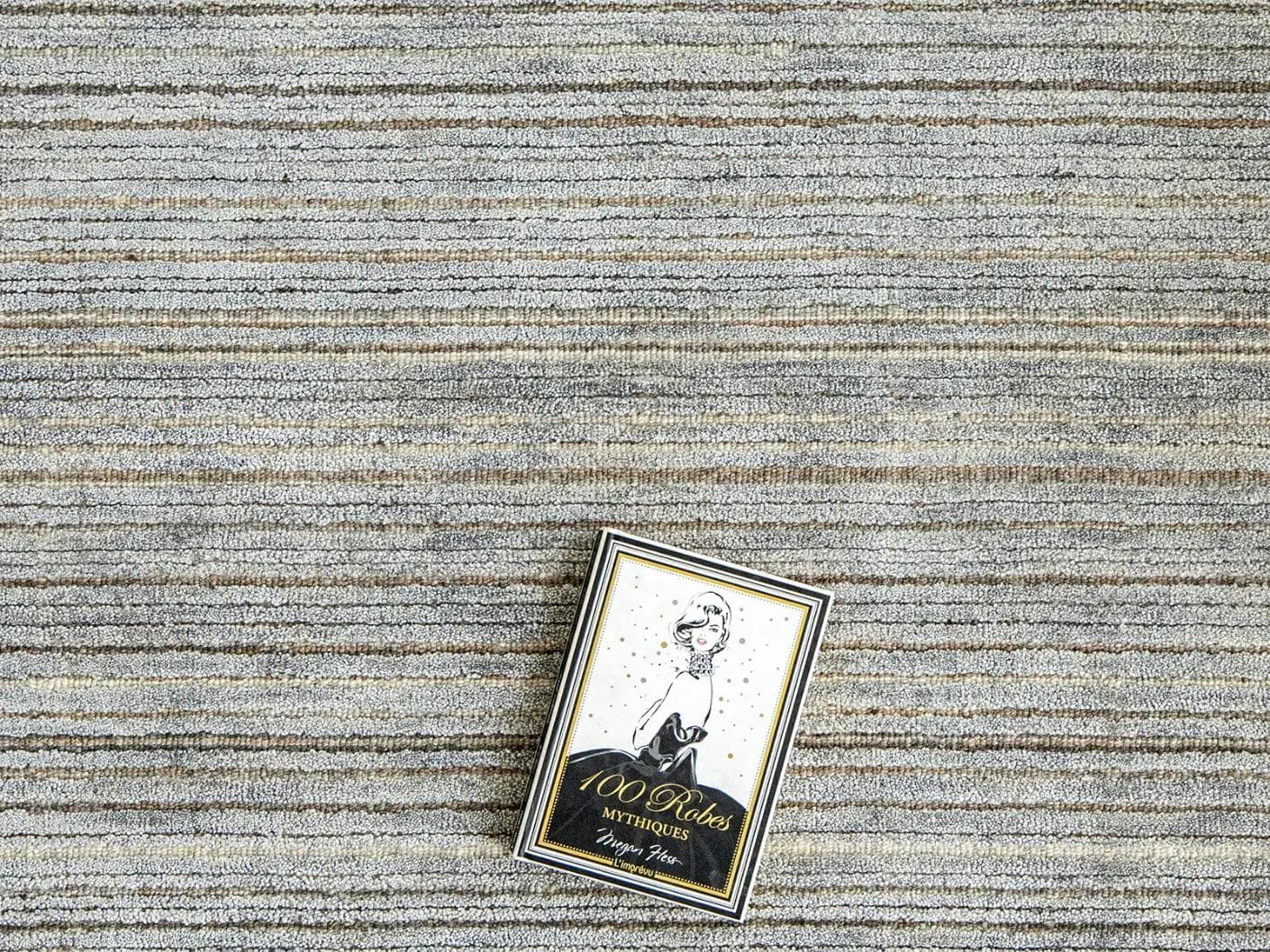 Rita Stevens carpet in grey, shown in a lifestyle top view as image 6