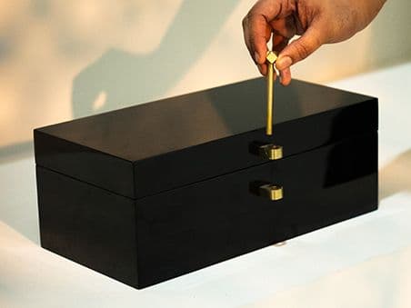 Romare Cornell accessory in black, shown in a lifestyle left view as image 5