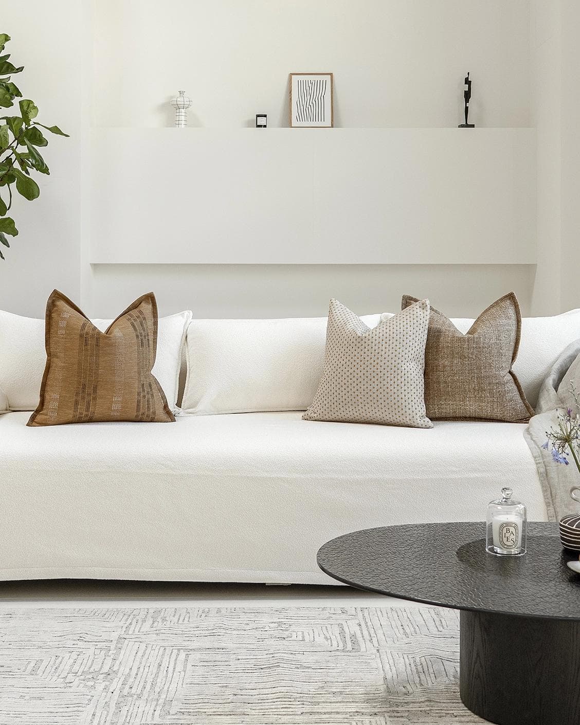 Romi Bundle cushion in brown and beige, shown in a lifestyle front view as image 4
