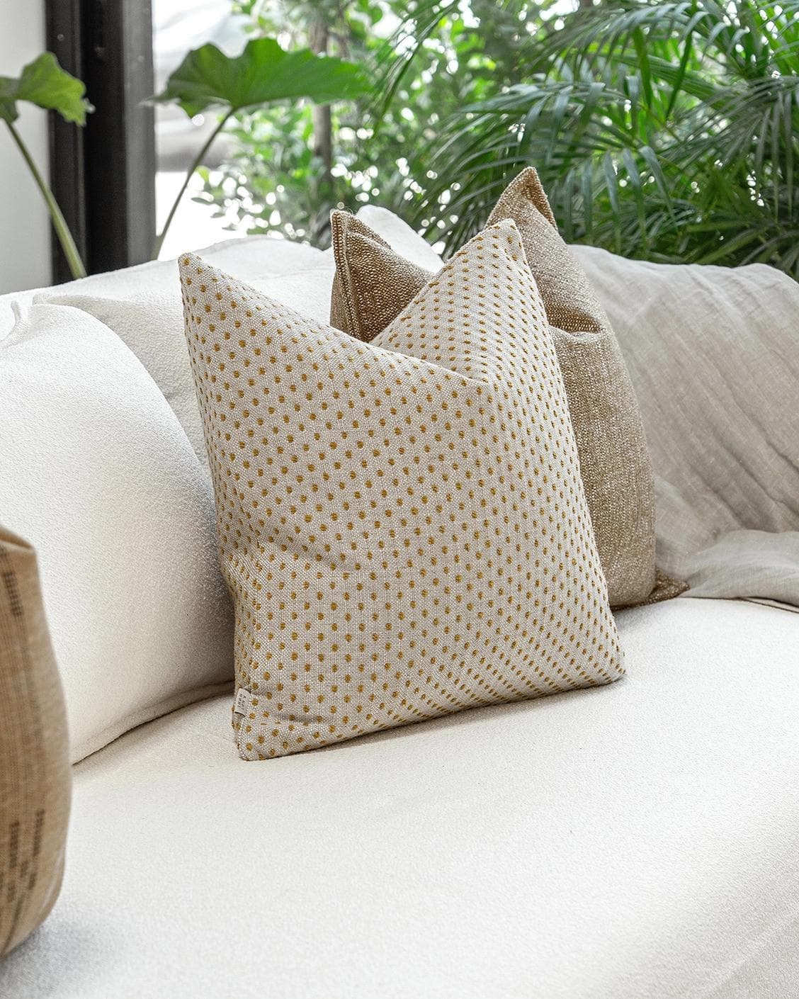 Romi Bundle cushion in brown and beige, shown in a product left view as image 5