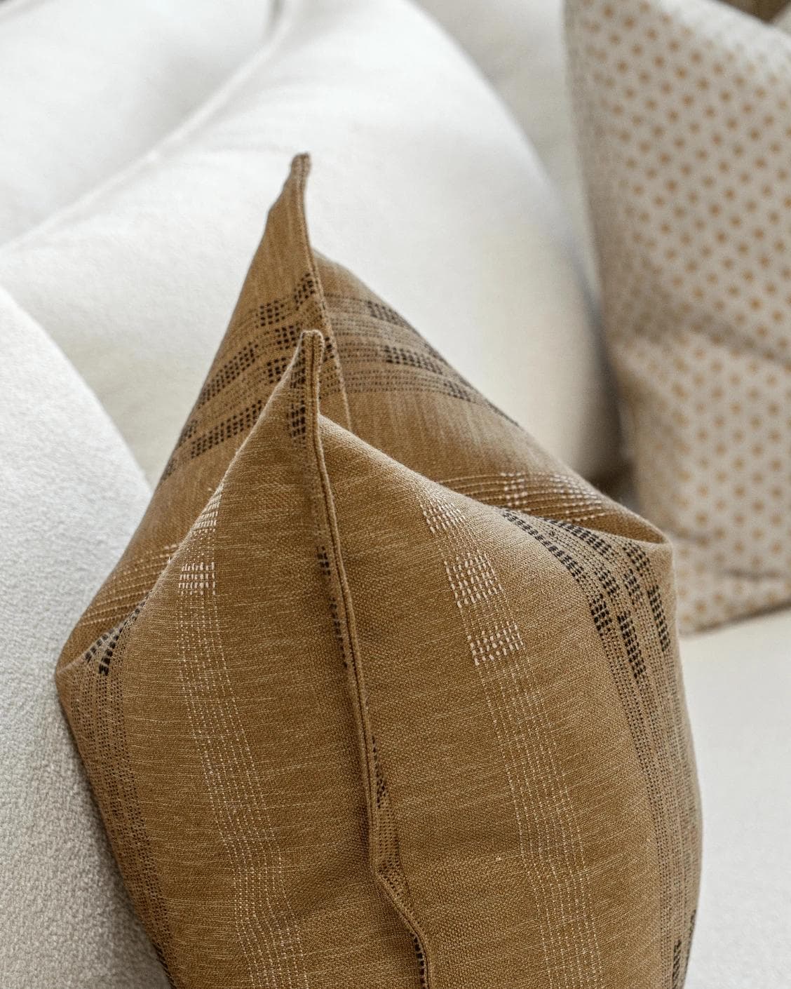 Romi Bundle cushion in brown and beige, shown in a product left view as image 6