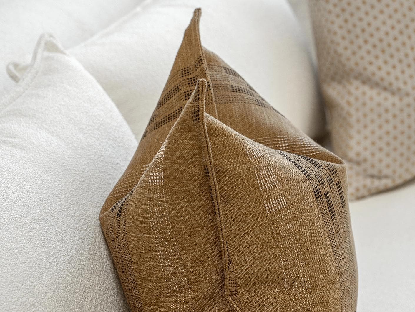 Romi Bundle cushion in brown and beige, shown in a product left view as image 6