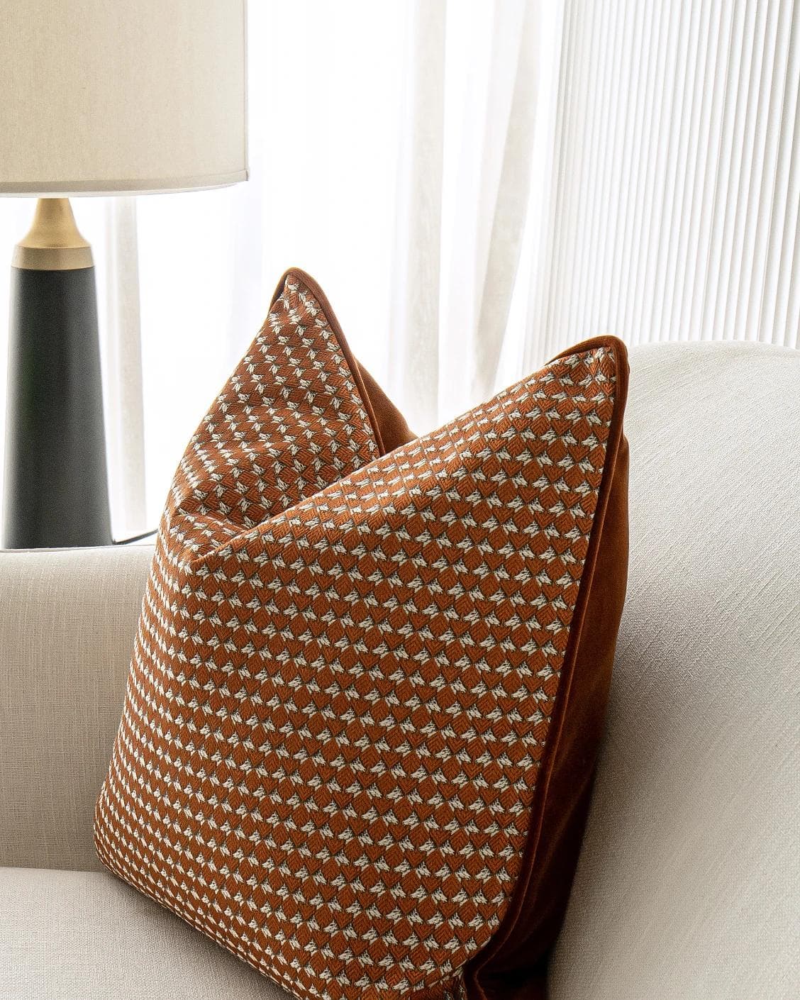 Rory Caravaggio cushion in orange, shown in a lifestyle right view as image 5