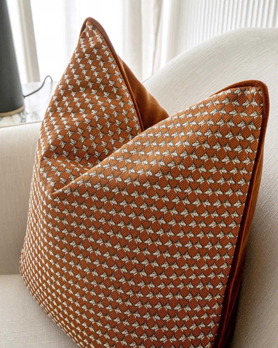 Rory Caravaggio cushion in orange, shown in a lifestyle right view as image 6