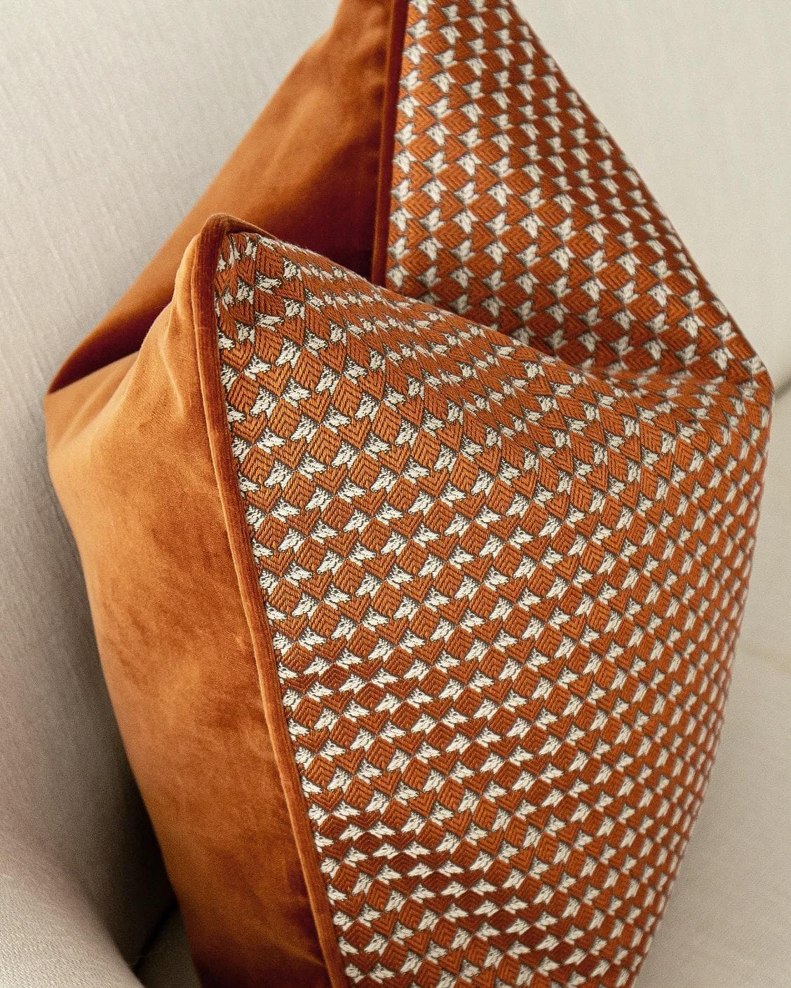 Rory Caravaggio cushion in orange, shown in a lifestyle top view as image 7