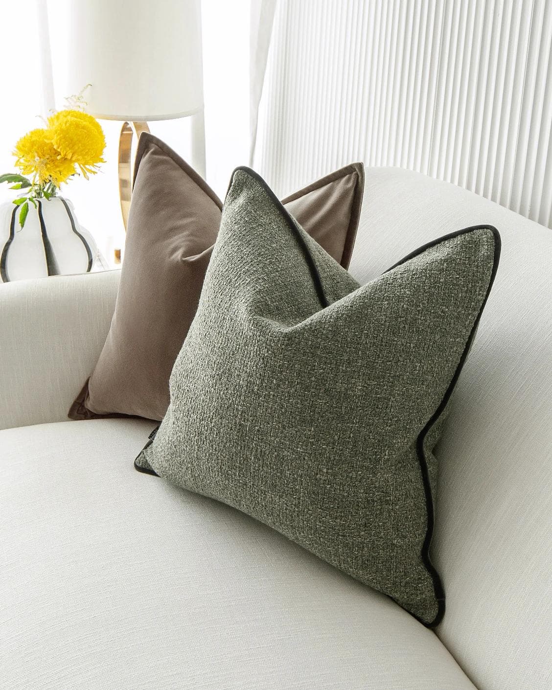 Roux Bundle cushion in orange, brown and green, shown in a lifestyle right view as image 5