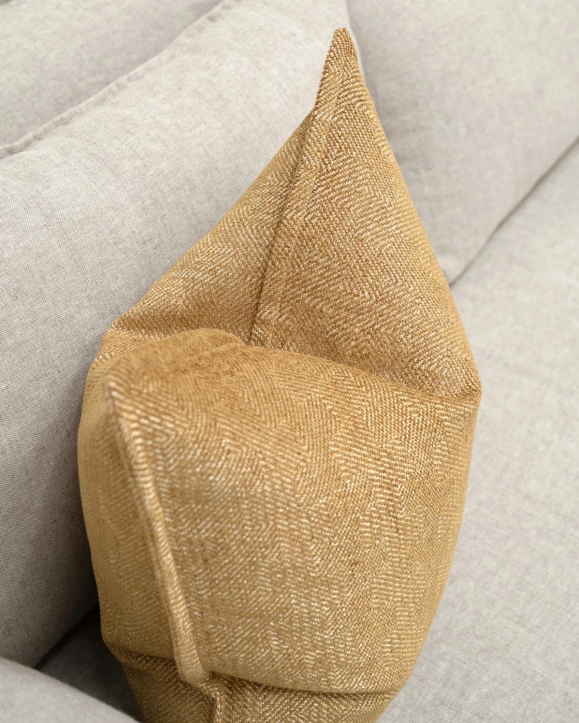 Rue Gaze cushion in beige, shown in a lifestyle top view as image 5