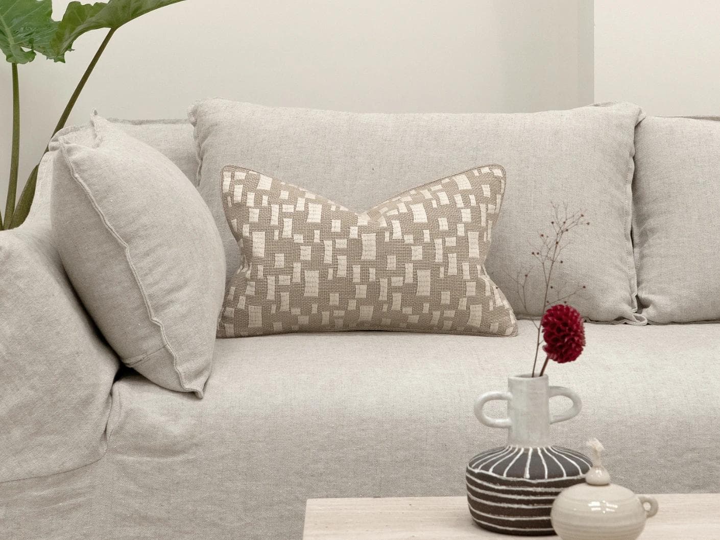 Ruth Laurent II cushion in beige and ivory, shown in a lifestyle front view as image 4