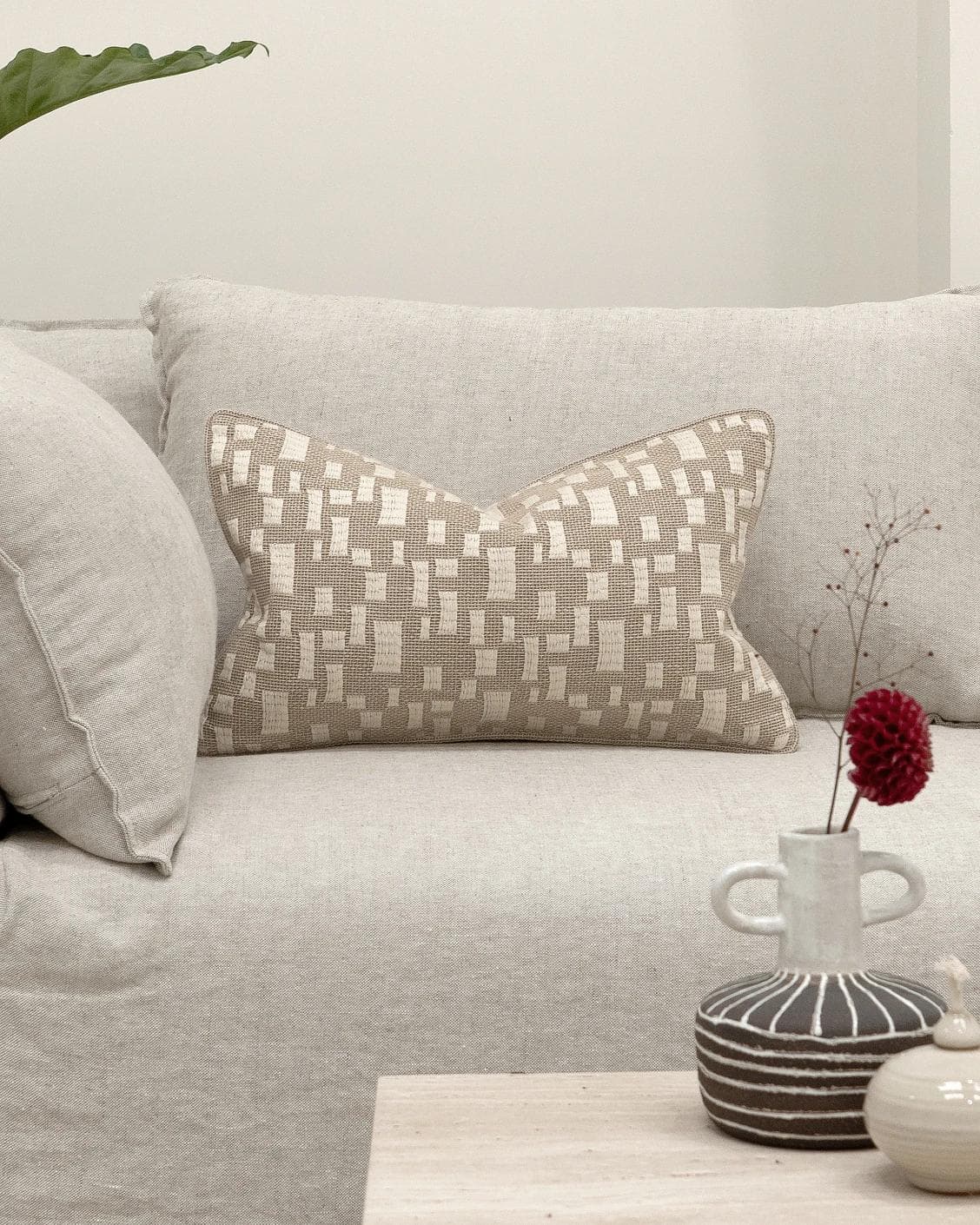 Ruth Laurent II cushion in beige and ivory, shown in a lifestyle front view as image 4