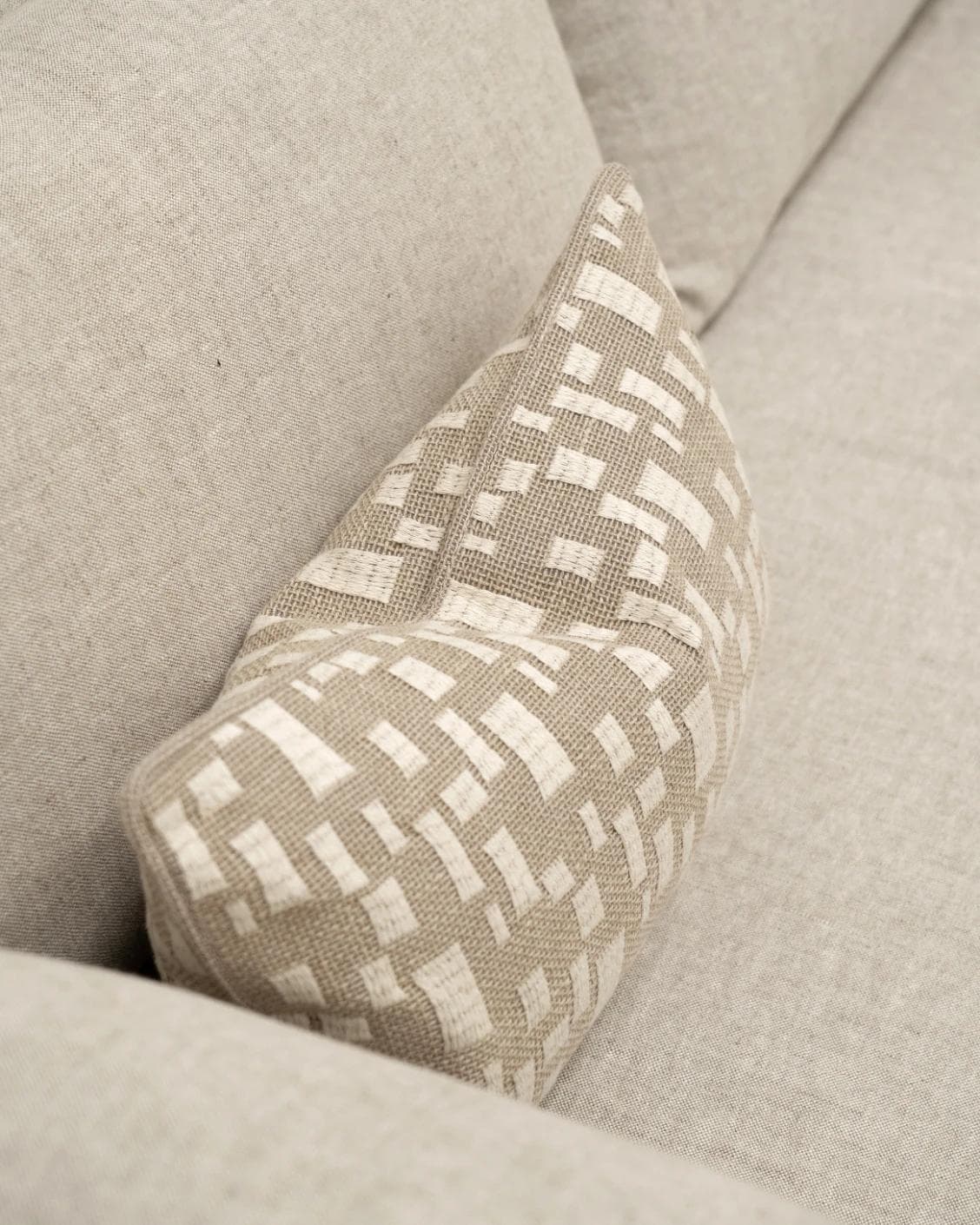 Ruth Laurent II cushion in beige and ivory, shown in a lifestyle top view as image 5