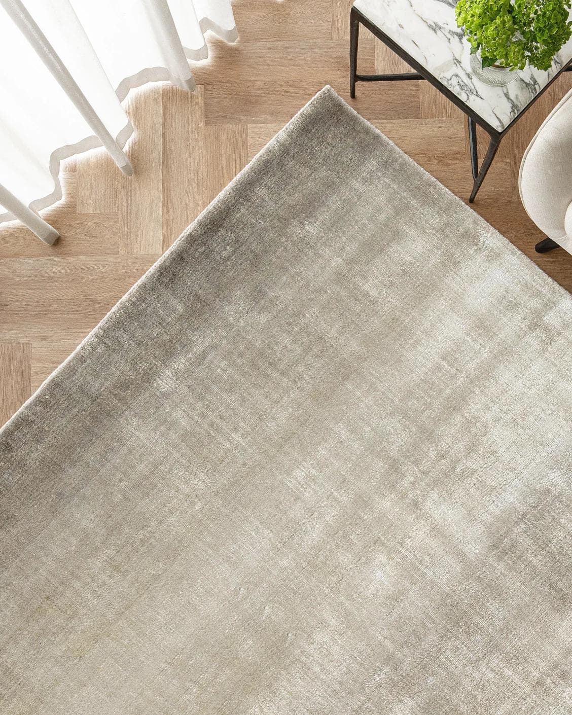 Scarlette Dune carpet in beige and brown, shown in a lifestyle top view as image 2