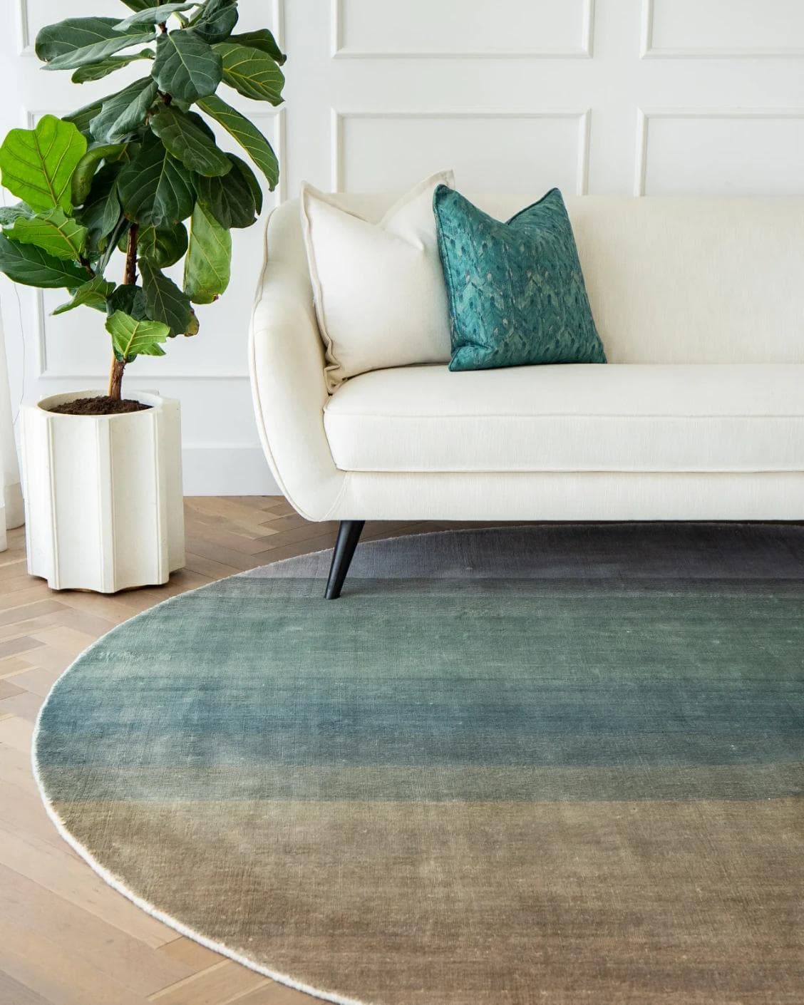 Scarlette Sage Round carpet in beige and green, shown in a lifestyle front view