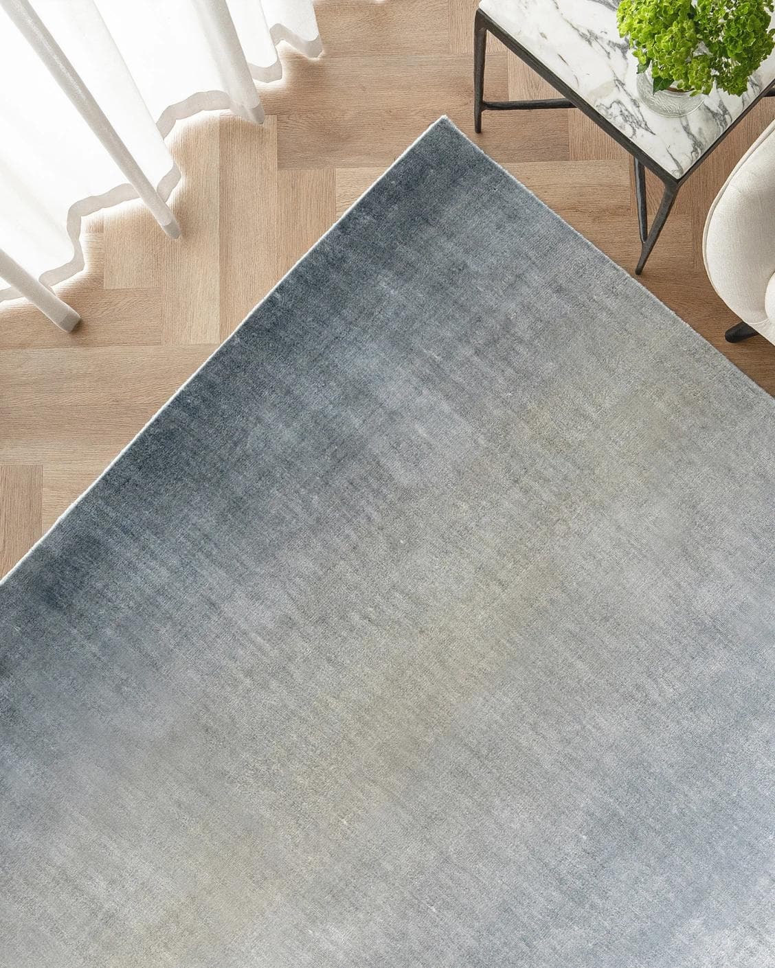 Scarlette Sky carpet in blue, shown in a lifestyle top view as image 2