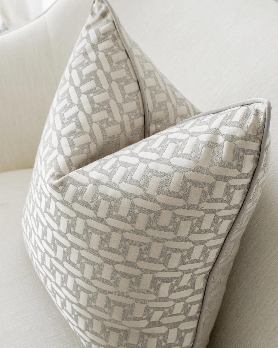 Selena Laurent cushion in white and silver, shown in a lifestyle top view as image 5