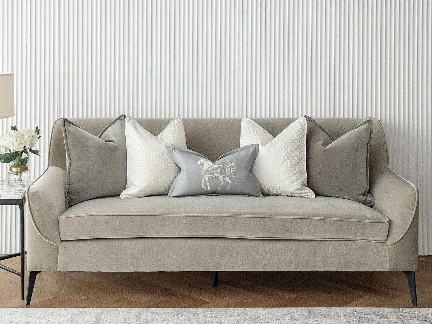 Lorenzo Bundle cushion in grey, white and blue, shown in a lifestyle front view as image 2