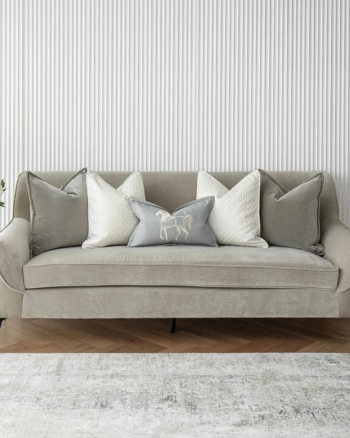 Lorenzo Bundle cushion in grey, white and blue, shown in a lifestyle front view as image 2