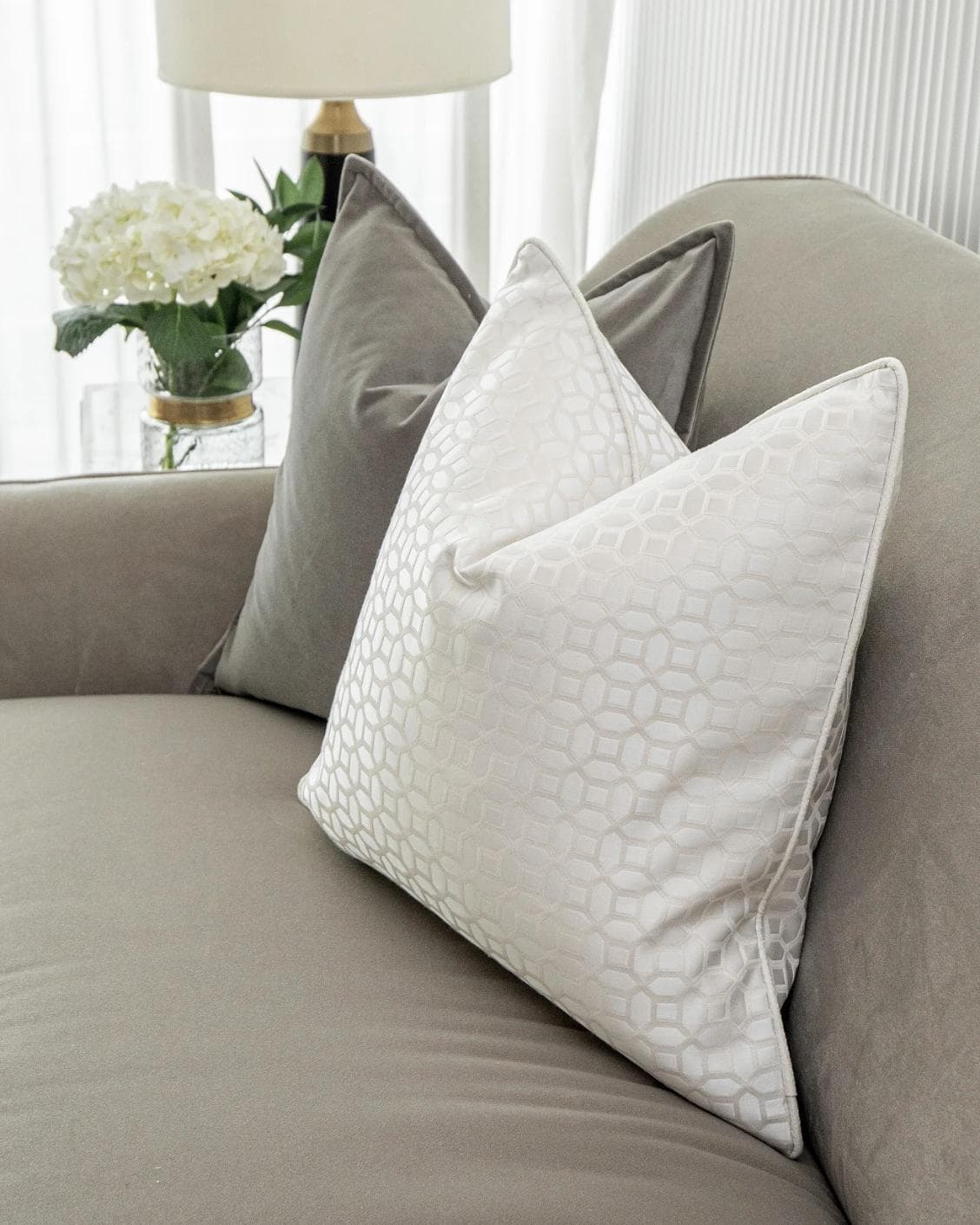 Lorenzo Bundle cushion in grey, white and blue, shown in a lifestyle right view as image 4