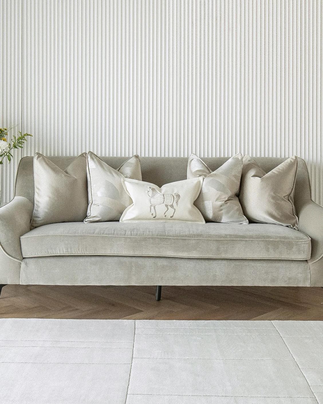 Issa Bundle cushion in gold, beige, silver and white, shown in a lifestyle front view as image 4