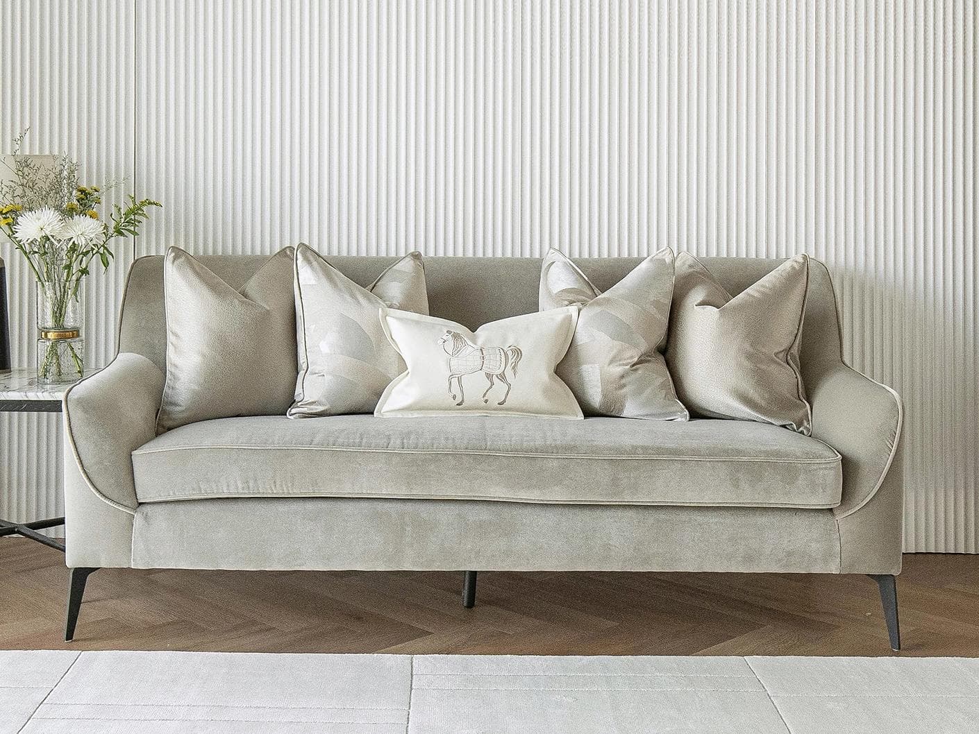 Issa Bundle cushion in gold, beige, silver and white, shown in a lifestyle front view as image 4