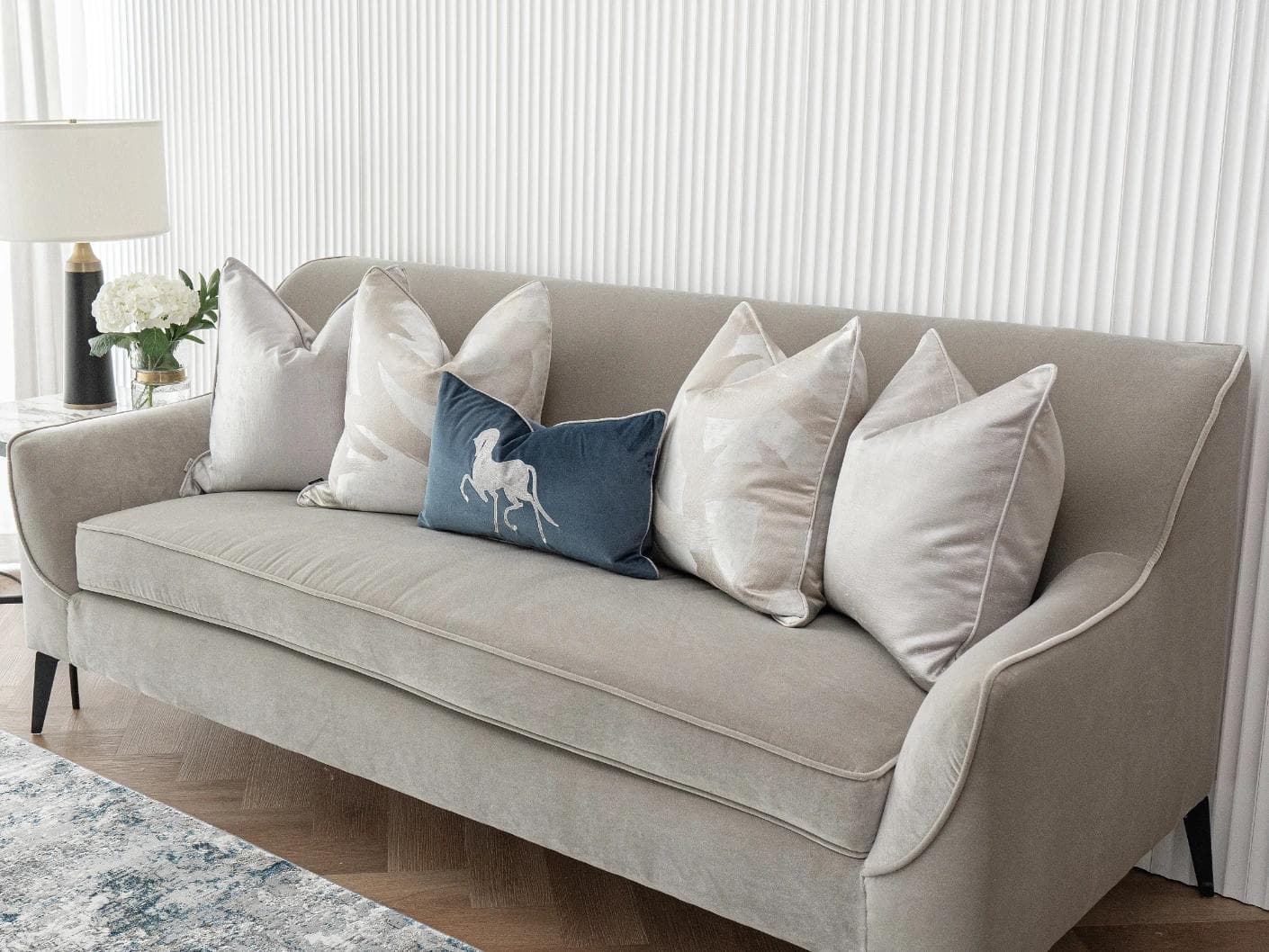 Miguel Bundle cushion in silver, beige and blue, shown in a lifestyle right view as image 4