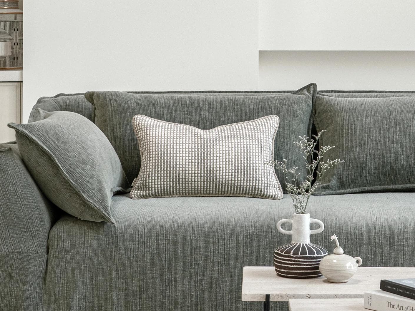 Shea Laurent II cushion in beige, shown in a lifestyle front view as image 4