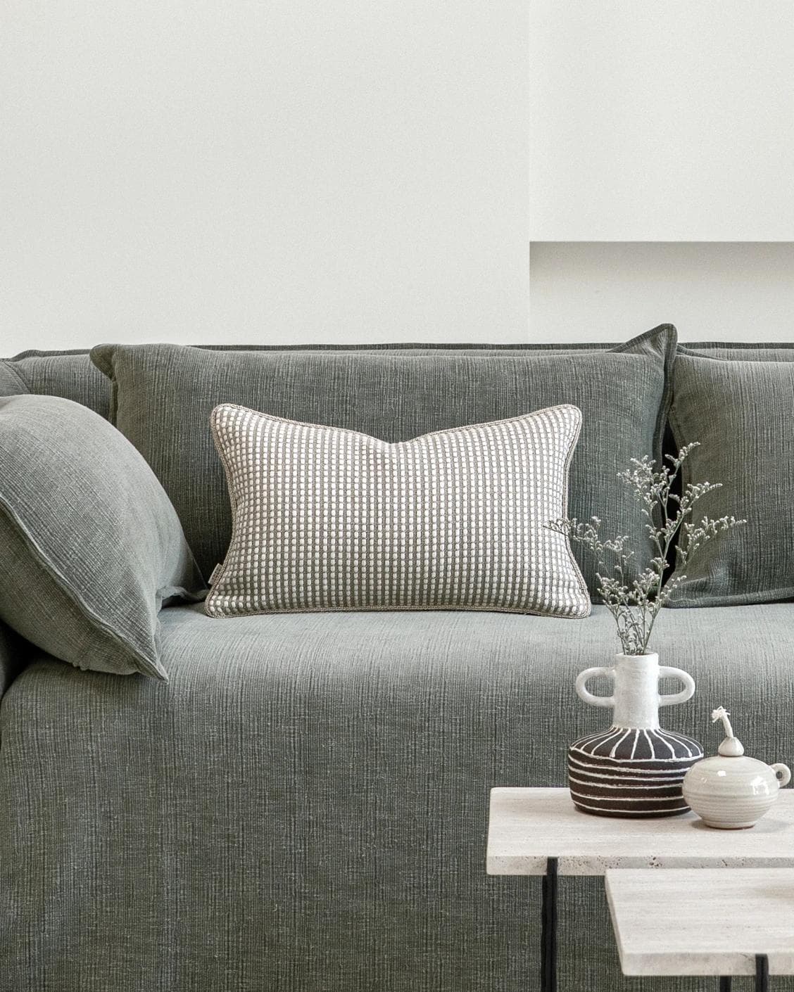 Shea Laurent II cushion in beige, shown in a lifestyle front view as image 4